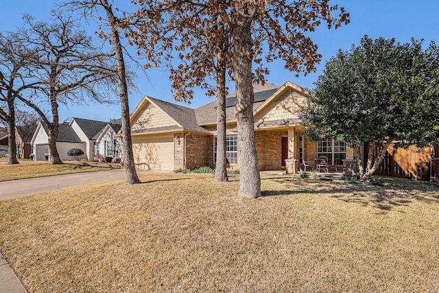 view of front of home featuring a front lawn and a garage