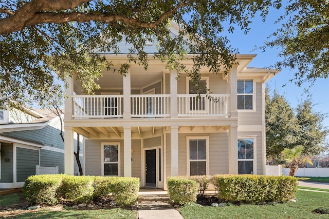 view of front of house with a balcony