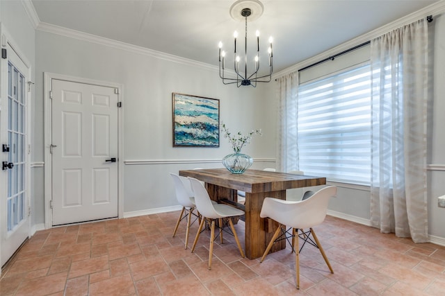 dining area with an inviting chandelier and crown molding