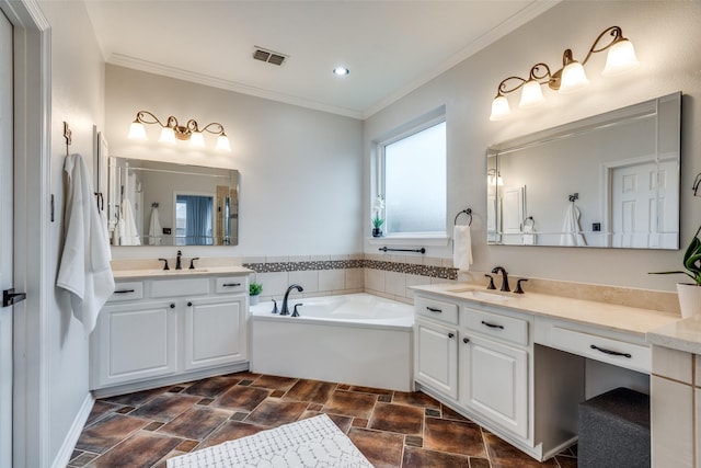 bathroom with a tub to relax in, ornamental molding, and vanity