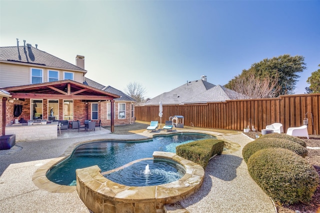 view of swimming pool with a patio and an in ground hot tub