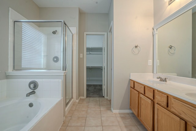 bathroom featuring vanity, tile patterned floors, and independent shower and bath