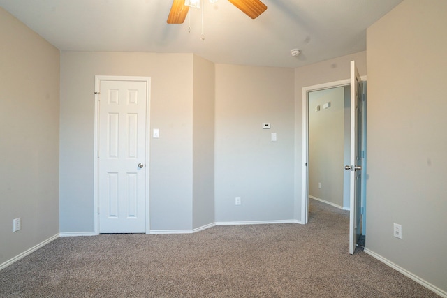 unfurnished bedroom with ceiling fan and carpet flooring