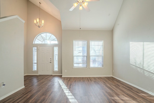 entrance foyer featuring ceiling fan with notable chandelier, high vaulted ceiling, dark hardwood / wood-style floors, and a healthy amount of sunlight