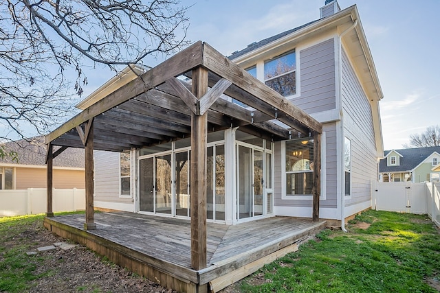 rear view of property with a deck