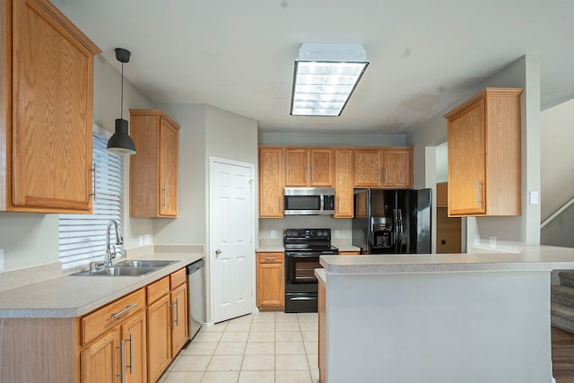 kitchen featuring decorative light fixtures, black appliances, sink, light tile patterned floors, and kitchen peninsula