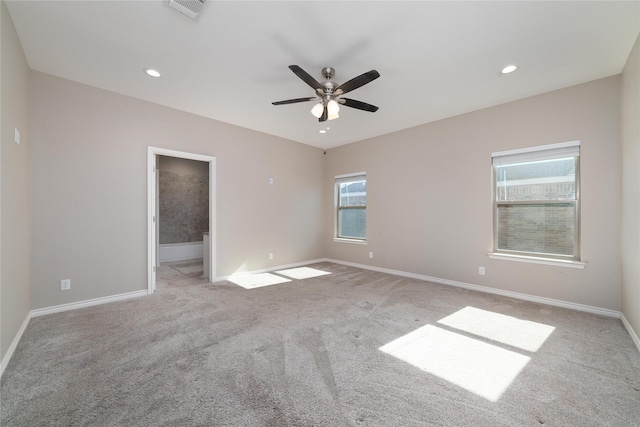 spare room with light carpet and ceiling fan