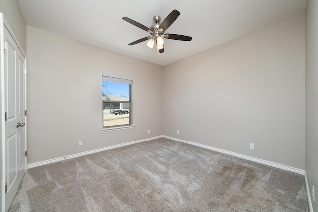 unfurnished room featuring light carpet and ceiling fan