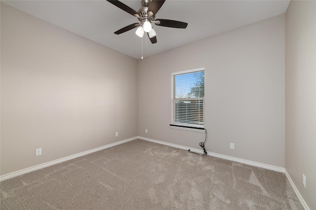 empty room with light colored carpet and ceiling fan