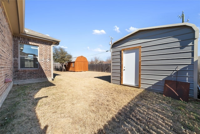 view of yard with a storage unit