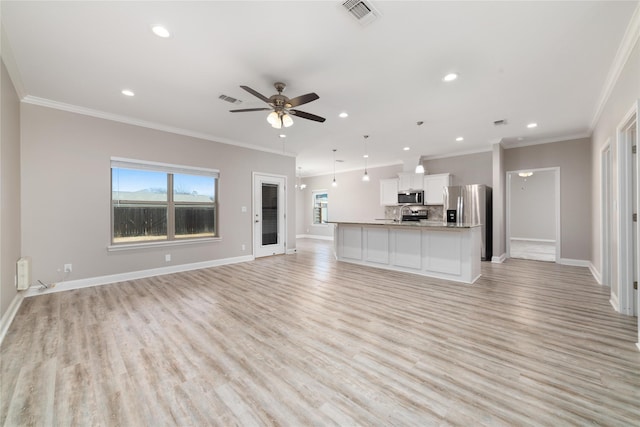 unfurnished living room featuring crown molding, ceiling fan, and light hardwood / wood-style flooring