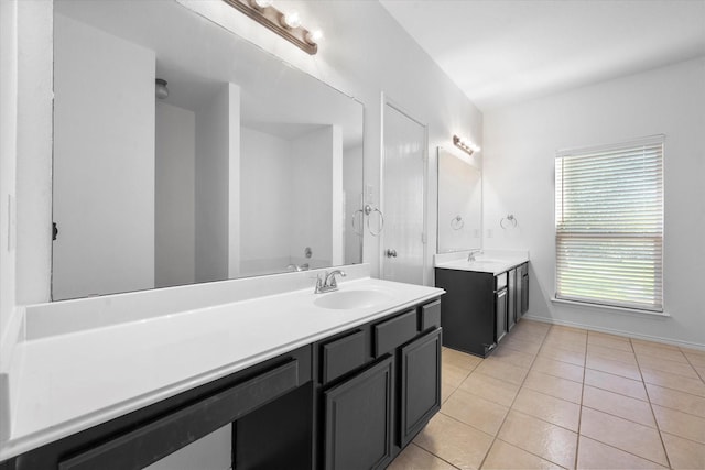 bathroom with tile patterned floors and vanity