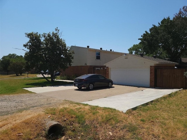 833 James St, Azle, TX 76020 - view of front of house featuring concrete driveway, an attached garage, brick siding, and a front lawn