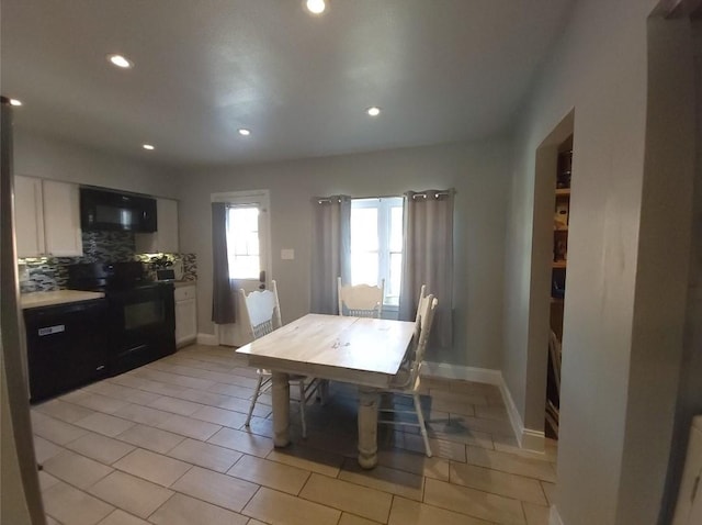 833 James St, Azle, TX 76020 - dining space featuring recessed lighting, light tile patterned floors, and baseboards