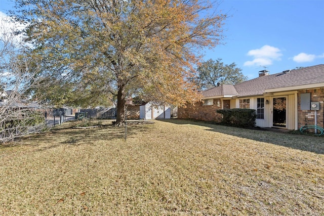 view of yard with a storage shed