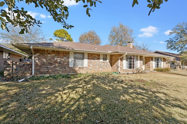 back of house with a yard