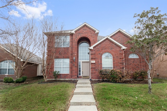 front facade featuring a front yard