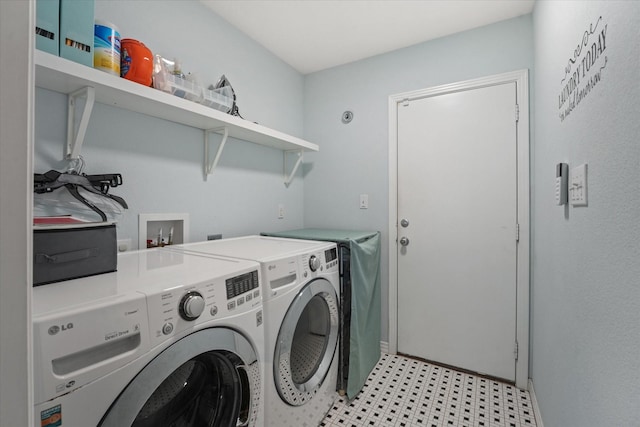 clothes washing area featuring independent washer and dryer