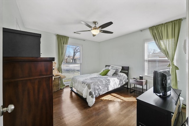 bedroom featuring dark wood-type flooring and ceiling fan