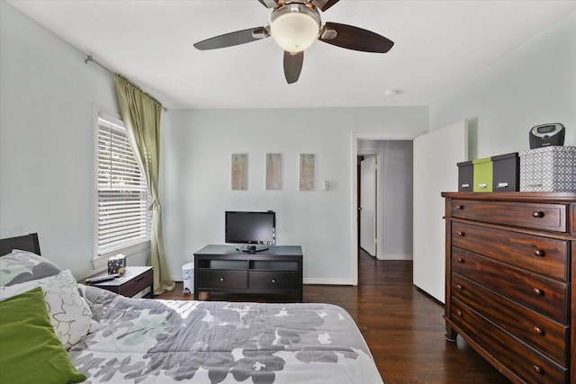 bedroom featuring ceiling fan and dark hardwood / wood-style floors