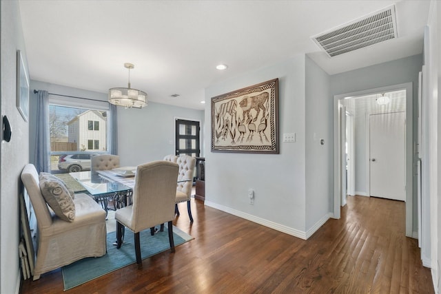 dining area featuring dark hardwood / wood-style floors