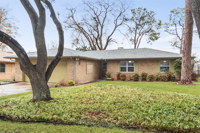 ranch-style house with a garage and a front yard