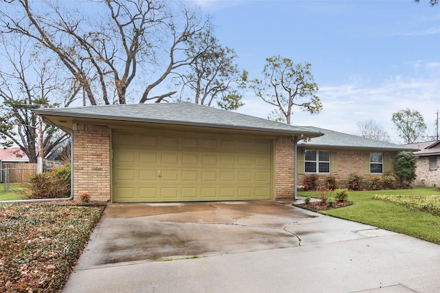 view of front of property with a garage and a front yard