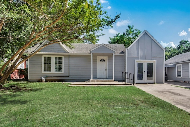 view of front facade with french doors and a front yard