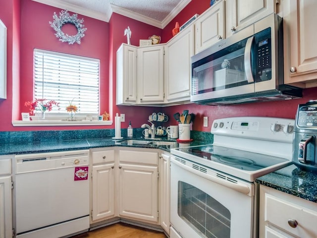 kitchen featuring sink, crown molding, light hardwood / wood-style flooring, white appliances, and white cabinets