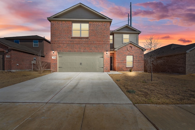 front facade with a garage and a yard