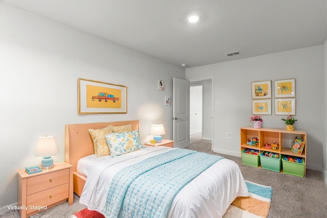 bedroom featuring light colored carpet