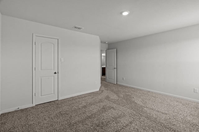 unfurnished room with carpet floors