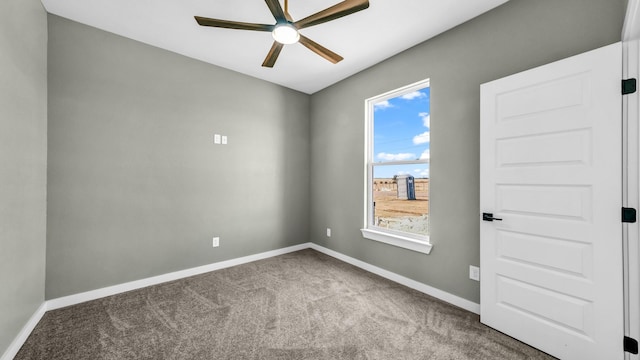 unfurnished room with ceiling fan and carpet flooring