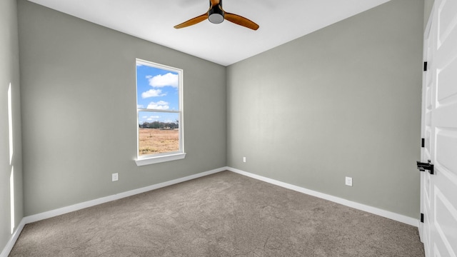 spare room with ceiling fan and carpet flooring