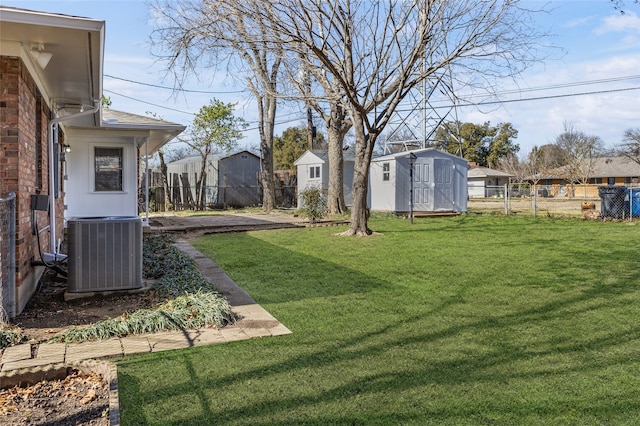 view of yard featuring cooling unit and a storage shed