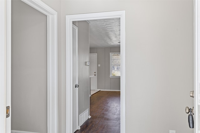 corridor featuring dark wood-type flooring