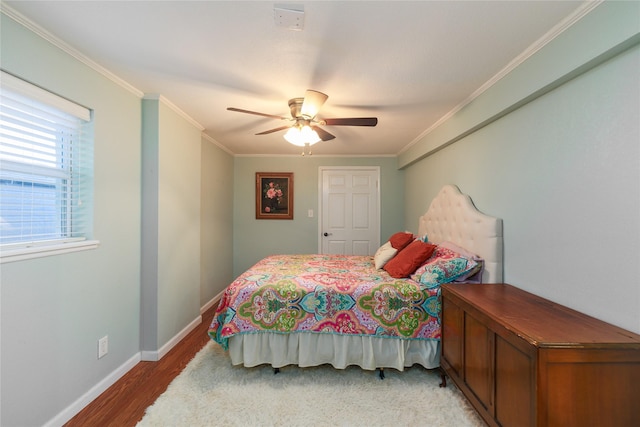 bedroom with ornamental molding, hardwood / wood-style floors, and ceiling fan