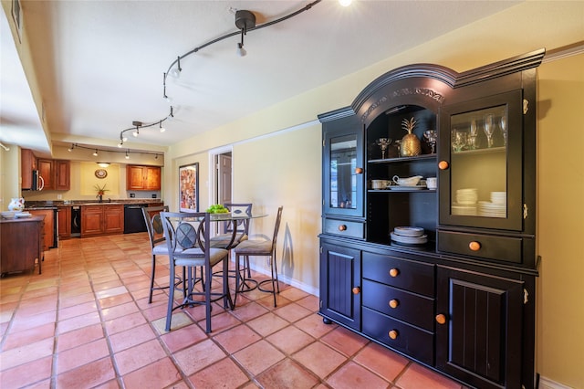 dining area featuring wine cooler and light tile patterned floors