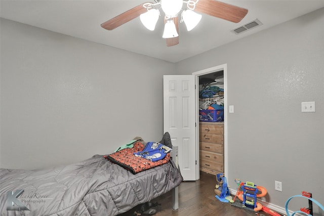 bedroom featuring dark wood-type flooring and ceiling fan