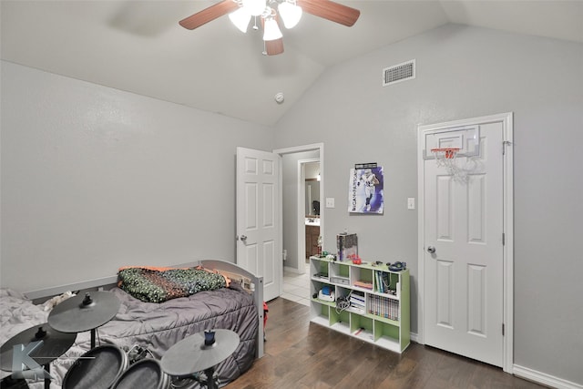 bedroom with lofted ceiling, dark wood-type flooring, and ceiling fan