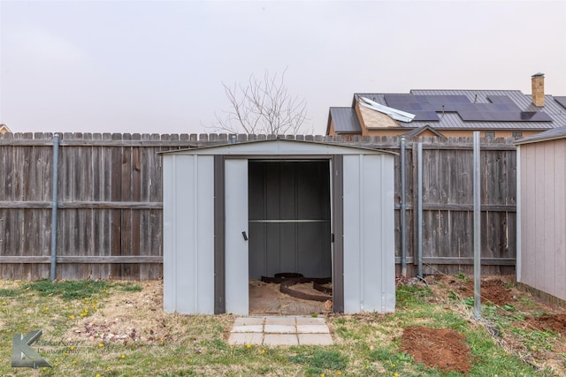 view of shed featuring a fenced backyard