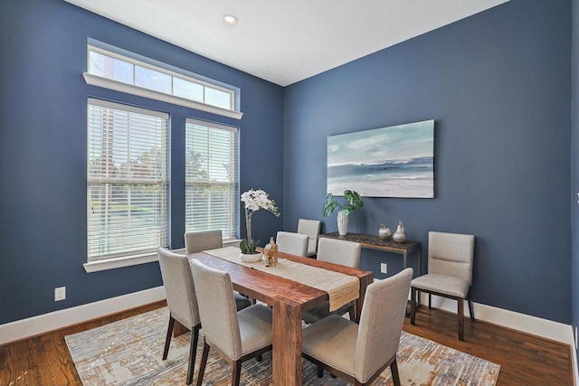 dining space with dark hardwood / wood-style floors