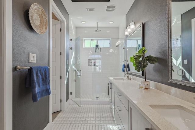 bathroom featuring tile patterned floors, vanity, and an enclosed shower