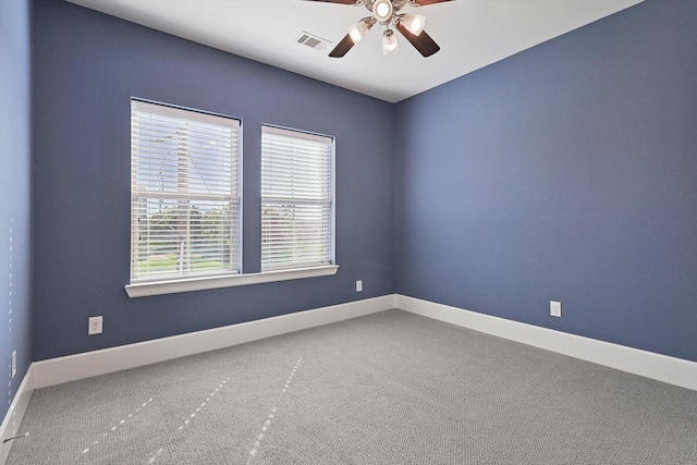 carpeted empty room with ceiling fan