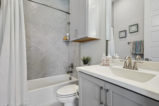 full bathroom featuring toilet, vanity, and shower / bathtub combination with curtain