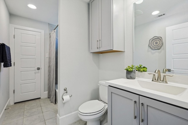 full bathroom with vanity, shower / bath combination with curtain, tile patterned floors, and toilet