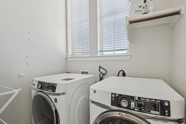 washroom featuring washer and dryer