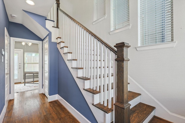 staircase with wood-type flooring