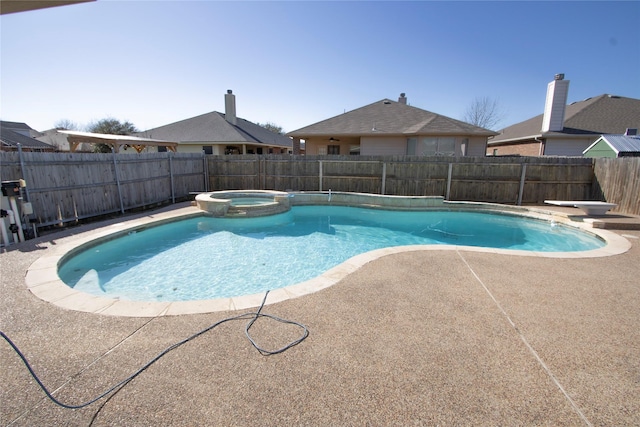 view of swimming pool with a patio area and an in ground hot tub