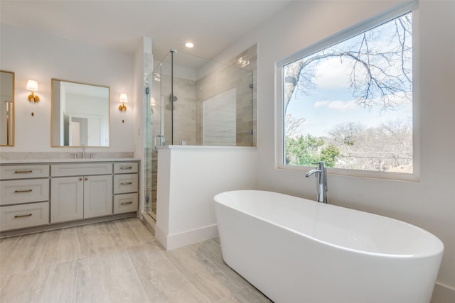 bathroom featuring vanity and shower with separate bathtub